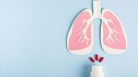 Lungs with medication next to it.