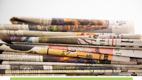 Newspapers stacked