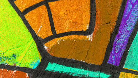  Abstract background image of a fragment of a colored graffiti painting in orange tones.