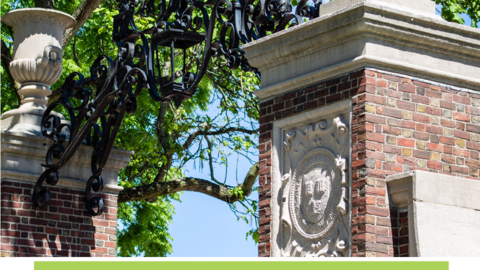 Close-up of brick column and iron archway at an entrance on Harvard campus.