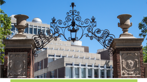 Arched brick and iron entryway on Harvard campus.