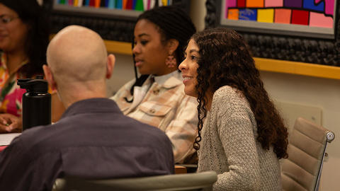Students sitting in workshop.