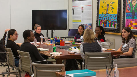 Professor Goldie having a discussion with undergraduate students.