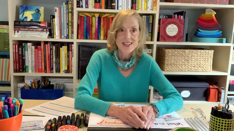 Sue J. Goldie sitting at home studio.
