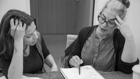 CSW teachers in a meeting.
