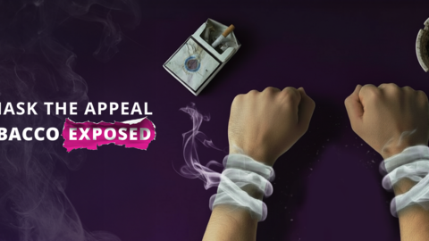 2 hands with smoke around wrists like handcuffs, a pack of cigarettes and an ashtray.