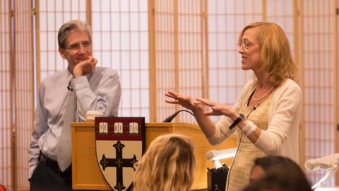 Sue J. Goldie and Julio Frenk speaking at front to students.