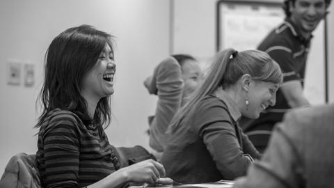 DrPH student laughing in a meeting.