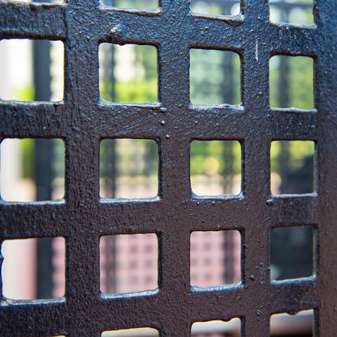 Close-up of iron gate.